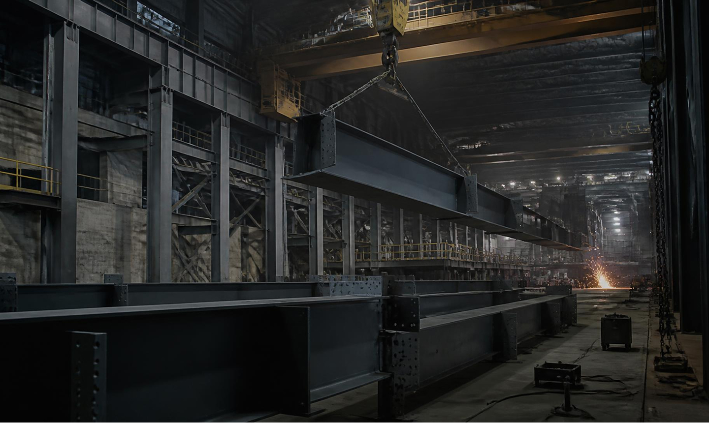 Steel beams being erected inside an industrial mill